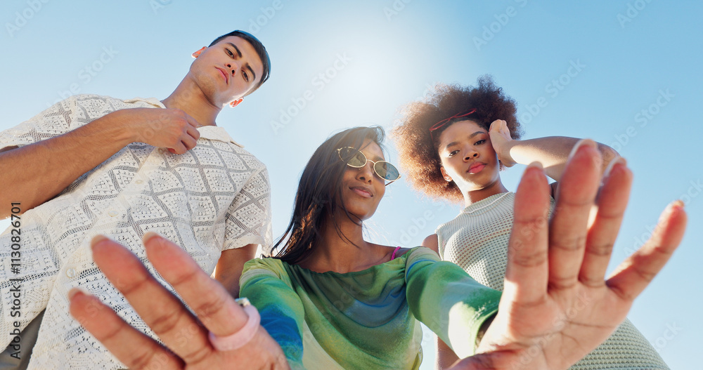 Obraz premium Friends, selfie and gen z people in low angle, blue sky or fashion with attitude for portrait in sunshine. Woman, group and hands for photography, memory or profile picture with streetwear in summer