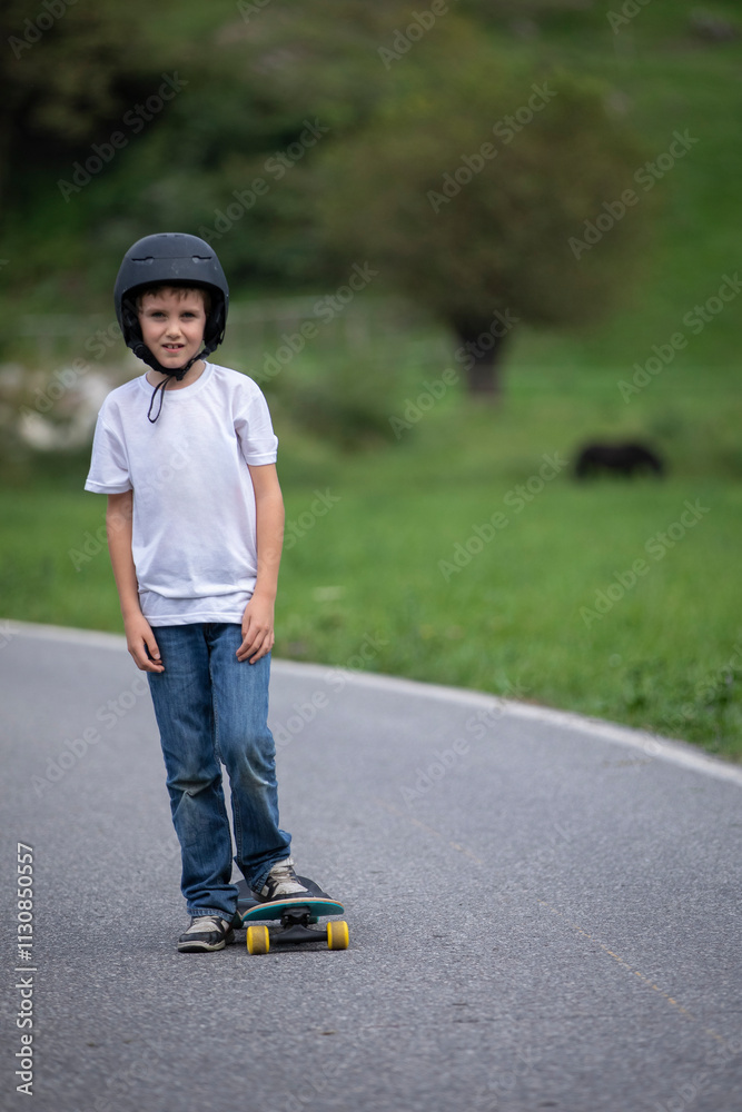 Fototapeta premium cute boy skating with his skate board on a summer day