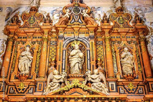 Seville, Spain, Stone sculptures of religious saints on an altar of the Catholic Cathedral
