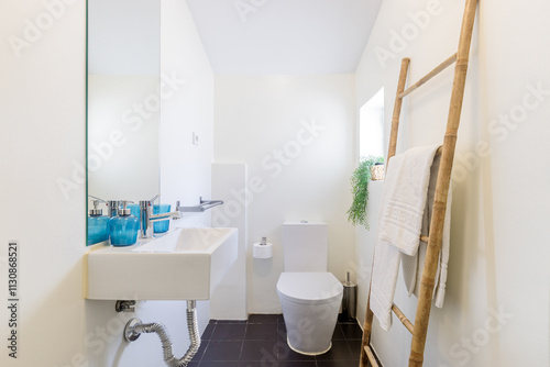 Tranquil bathroom design with rustic towel racks