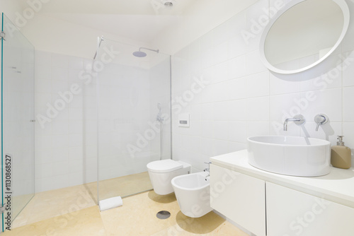 Minimalist bathroom featuring sleek shower.