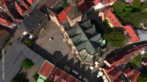 Aerial view of Osnabruck city center and Saint Peter Cathedral standing out in the urban landscape. Sunny Day in Germany photo