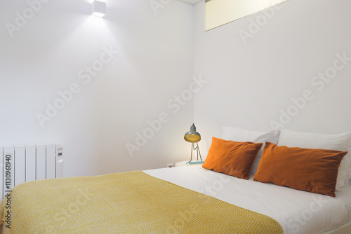 Cozy, modern bedroom with relaxing, bright atmosphere.