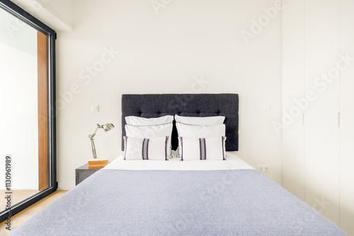 Cozy, modern bedroom with relaxing, bright atmosphere.