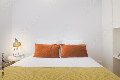 Cozy, modern bedroom with relaxing, bright atmosphere.