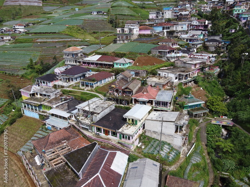 The beauty of the landscape Leek and vegetable plantations and architecture of the arrangement of terraced houses in the tourist area of ​​Nepal van Java, Butuh Hamlet, Magelang, indonesia photo