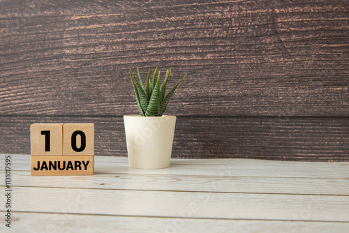 A close-up of a wooden calendar block showing January 10. photo