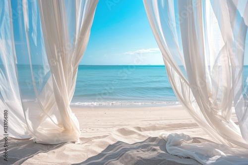 White fabric curtains fluttering gracefully on beach shade near sea with breeze and sand