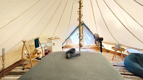A luxury glamping hotel tipi tent experince with cosy details and interior design 