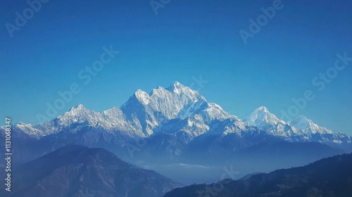 snowy mountain peaks under clear blue sky, serene and majestic, perfect for capturing the grandeur of untouched nature