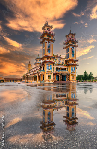 Cao Dai temple area and meditating followers of the Cao Dai religion in the temple Cao Dai, Tay Ninh, Vietnam photo