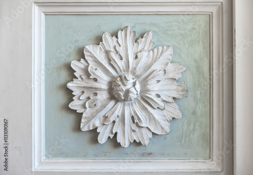 White stucco plafond decoration over green backdrop photo