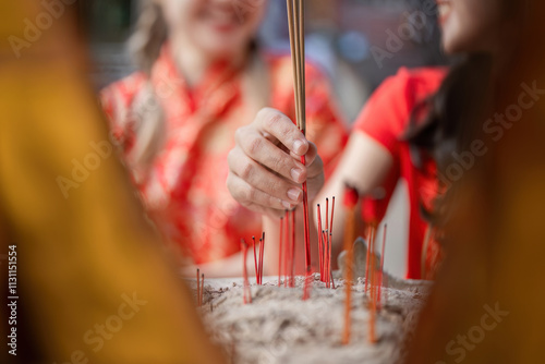 Celebrating chinese new year with incense offerings local temple cultural rituals festive environment close-up viewpoint tradition emphasis photo