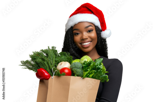 Woman with santa hat holding fresh vegetables in paper bag smiling isolated on transparent png background.