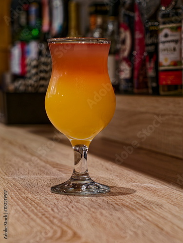 Cocktail glass sex on the beach on bar