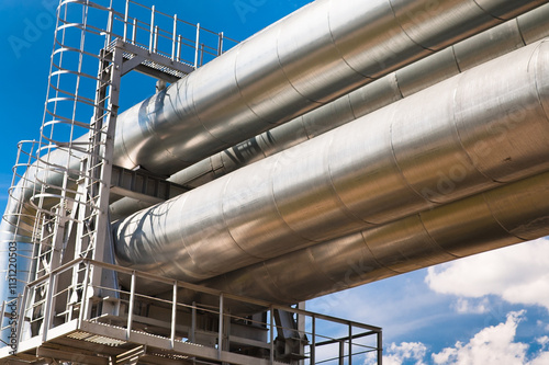 pipeline with ladder against blue sky photo