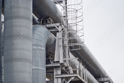 close-up of pipeline against grey sky photo