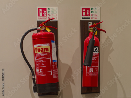 Fire extinguisers hanging on wall