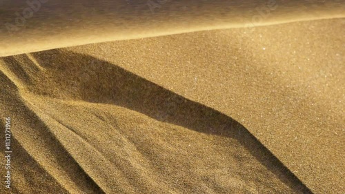 Sands move during desert sandstorm. Quicksand in the desert. Wind carries the sand along the dune in the desert. Slow motion 4K shot