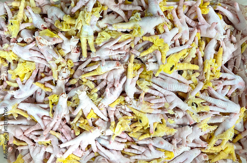 Top view seamless photo of pile of chicken foots.