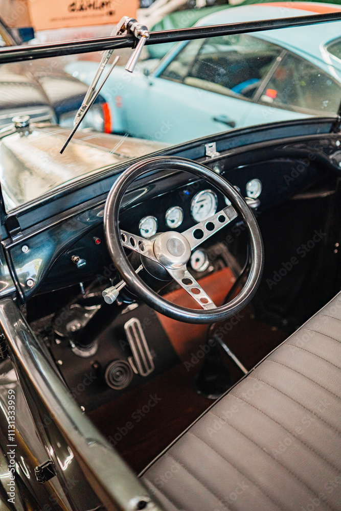 Obraz premium Classic Car Steering Wheel and Dashboard with Vintage Design Elements