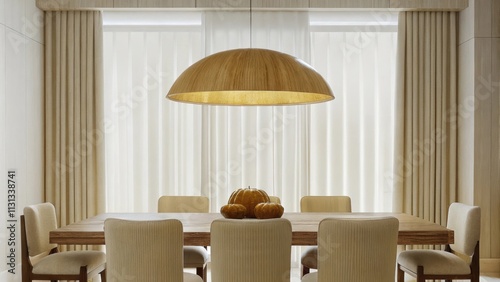 A spacious dining area with a minimalist wooden table surrounded by beige upholstered chairs complemented by a statement pendant light with a warm golden hue and a centerpiece of