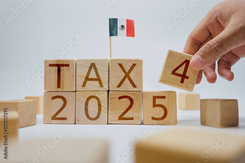 Wooden Blocks Depicting 'Tax 2025' with Mexican Flag in Background