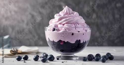 Blueberry ice cream in a tall clear glass bowl with whipped cream on top , dessert, sweet