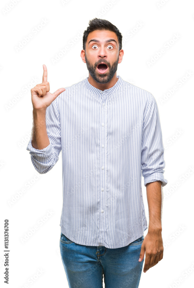 Naklejka premium Adult hispanic man over isolated background pointing finger up with successful idea. Exited and happy. Number one.
