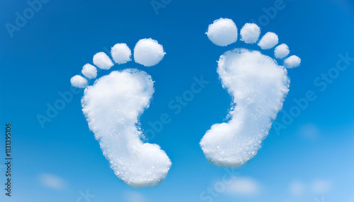 In a bright blue sky, two fluffy clouds shape themselves into adorable baby footprints, creating a whimsical and joyful image that inspires feelings of innocence and awe