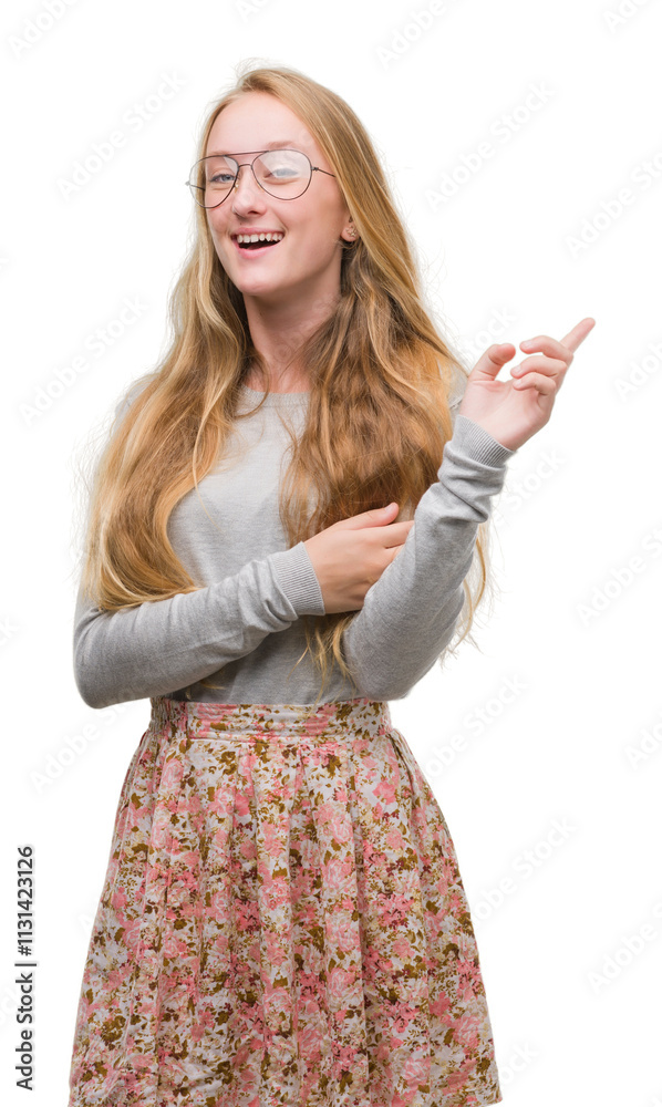 Φωτογραφία Blonde teenager woman wearing flowers skirt with a big smile on face, pointing with hand and finger to the side looking at the camera
