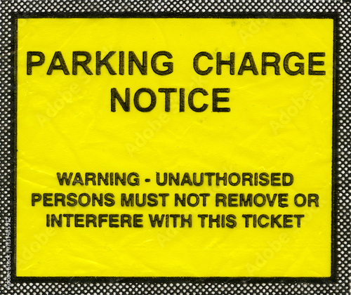 Obraz na płótnie Parking charge notice in the UK showing the message Warning - unauthorised persons must not remove or interfere with this ticket w salonie