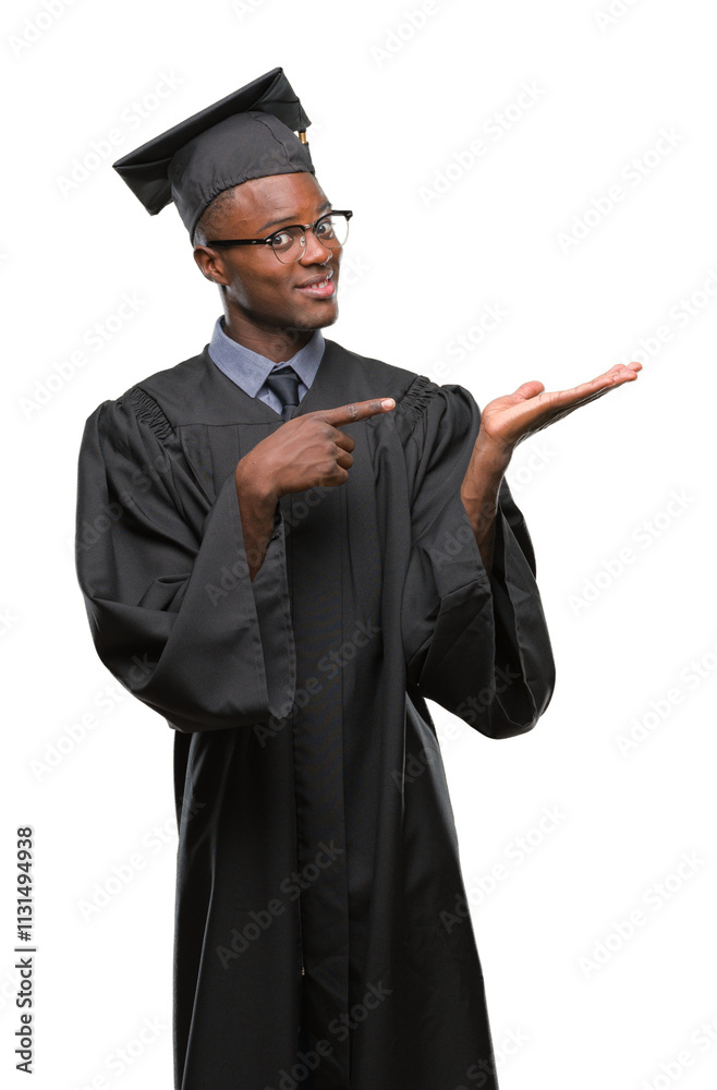 Φωτογραφία Young graduated african american man over isolated background amazed and smiling to the camera while presenting with hand and pointing with finger