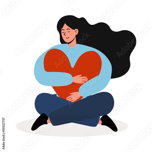 Woman sitting cross-legged and hugging a large heart symbol with happiness