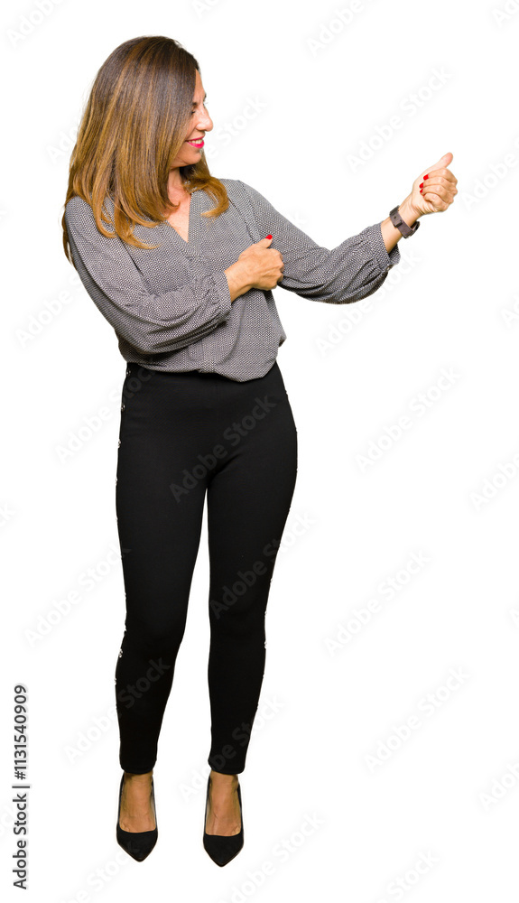 © Krakenimages.com - Beautiful middle age business woman Looking proud, smiling doing thumbs up gesture to the side