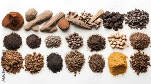 Collection of various soil samples, powders, and earthy materials arranged on a white background.