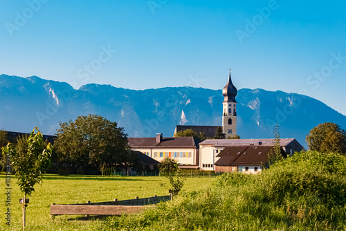 Church on a sunny summer day with Mount Untersberg in the background at Feldkirchen, Ainring, Berchtesgadener Land, Bavaria, Germany photo