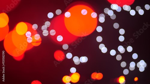 New Year and Christmas garlands red, yellow and white out of focus.