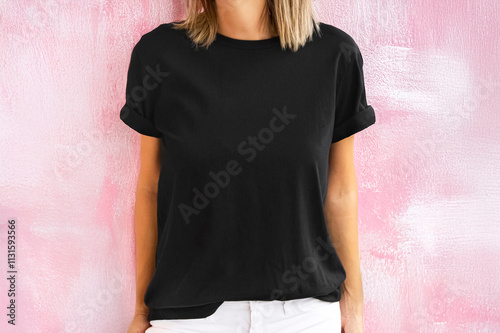 Girl wearing blank black t-shirt with copy space for your text or design. (Only background modified with AI ) T shirt mock up with pink background. print logo, design
