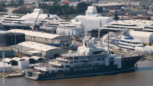 Commercial shipyard dock for luxury sea yachts manufacturing. Construction and assembling of deep water ships.