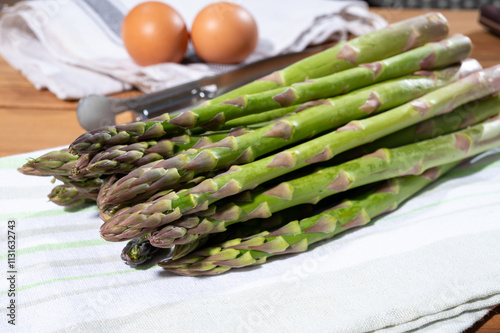 Bunch of fresh ripe green asparagus organic vegetables ready to cook or grill photo