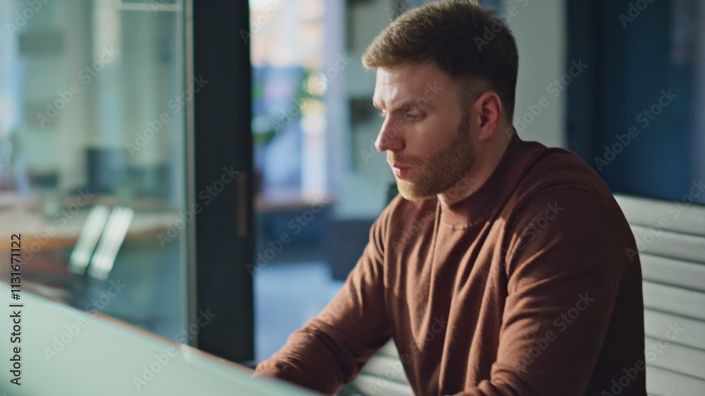 Obraz premium Pensive manager answering cellphone call working at office closeup. Smiling man