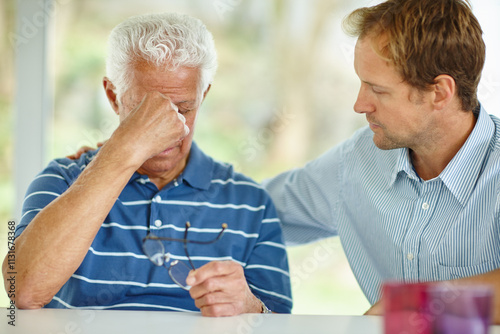 Depression, loss or pain with old man and son in home together for empathy, love or support as family. Grief, psychology or sad with male and senior father in apartment for safety, security or trust