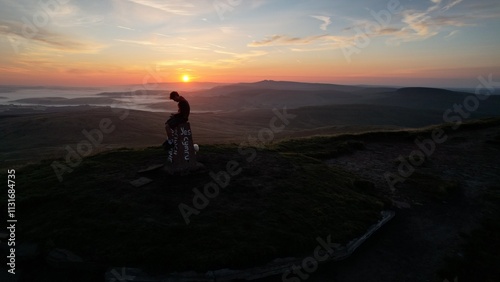 silhouette of a person in the mountains