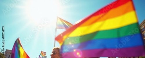 Colorful rainbow flags wave in bright sun. People march in pride parade. Vibrant floats, upbeat music. Joyful celebration of self-expression, pride. Community event. Pride parade celebration. Happy photo