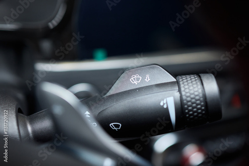 A detailed closeup view of the interior of a car, showcasing various controls and features photo