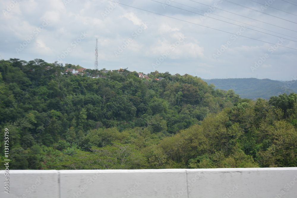 Obraz premium Green landscape view with clouds