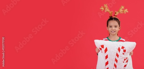 Cute little girl in reindee...