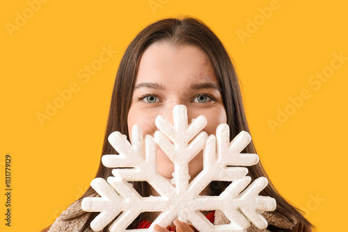 Young woman with snowflake ...