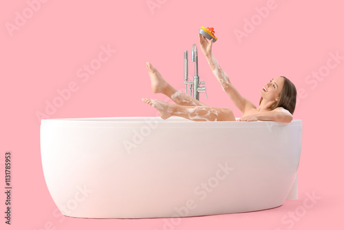 Young woman with toy ship t...